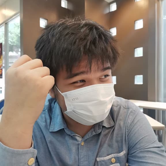 Joshua Dela Cruz sitting in a café
